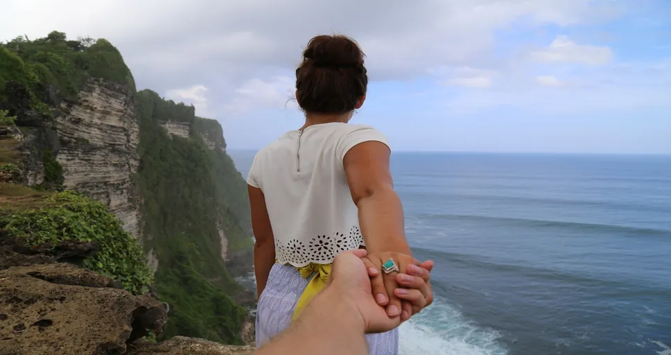 guy starts calling instead of texting - cliff, beach, holding hands