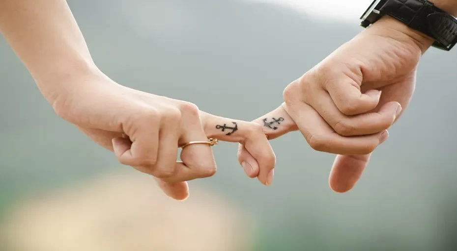 guy looking at phone - couple, hands, tattoos